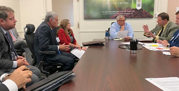 people talking around a conference table