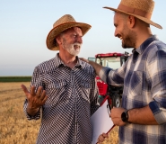 Farmers happy and smiling in a field