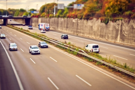various vehicles on a two way, 6 laned highway