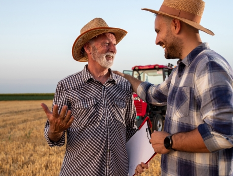 Farmers happy and smiling in a field